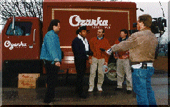 Chuck Norris donates Ozarka Water to Lars for the earthquake victims on Channel 5 News, Dallas.